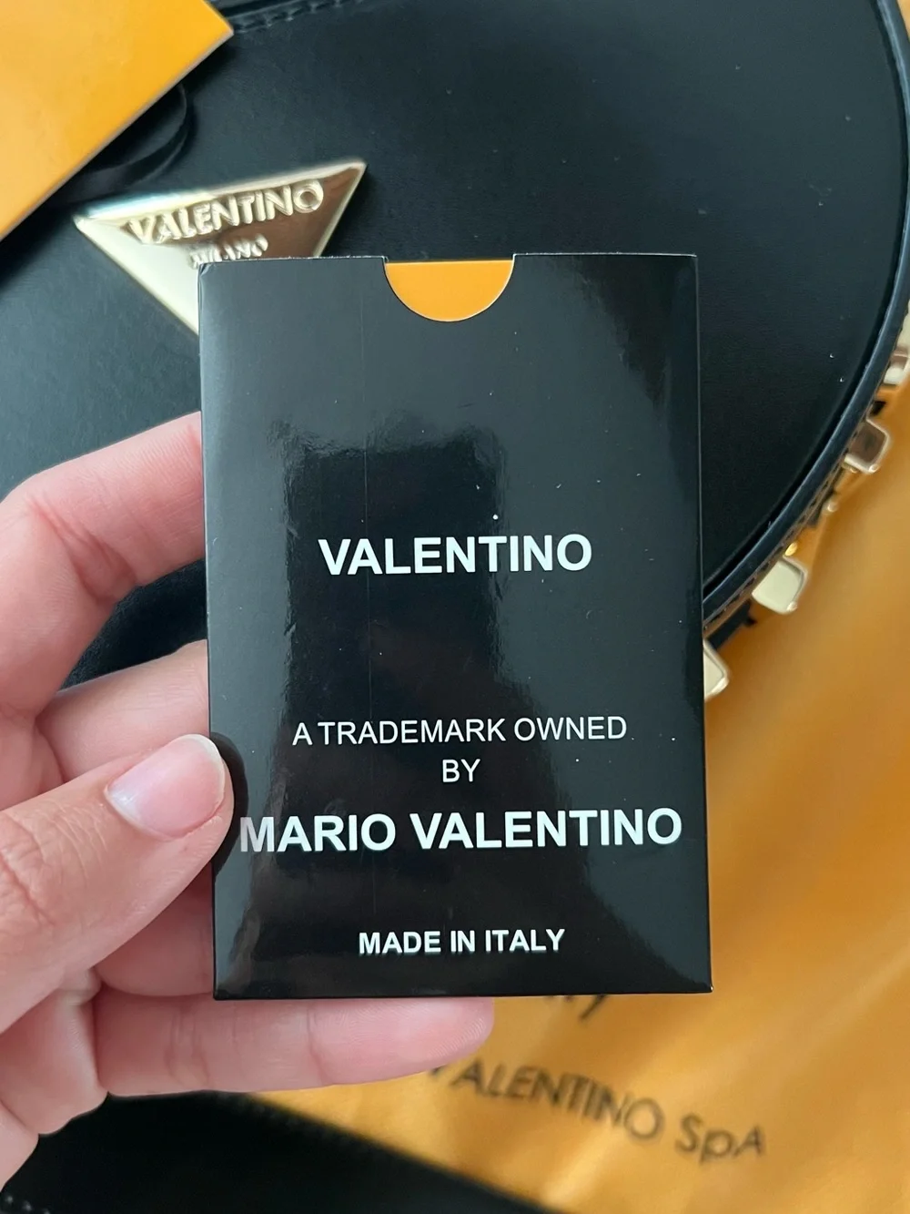 Valentino Black Leather Half-Moon Crossbody with Gold Accents